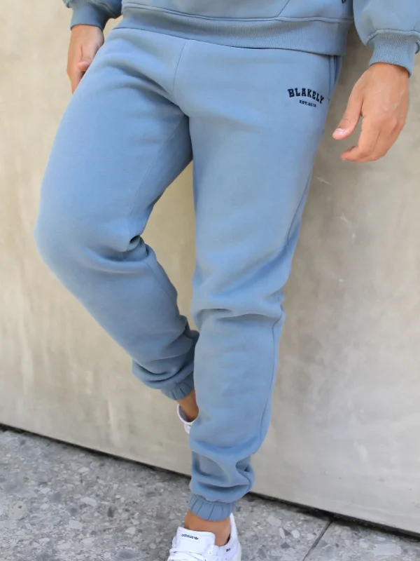 Men's Solid-Colored Pants for VersatilityVarsity Relaxed Sweatpants - Blue